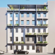 Ein Haus hat eine helle Fassade und Fenster mit grauen Rahmen. Auf den Loggien, Balkonen und Terrassen sind Pflanzen zu sehen.