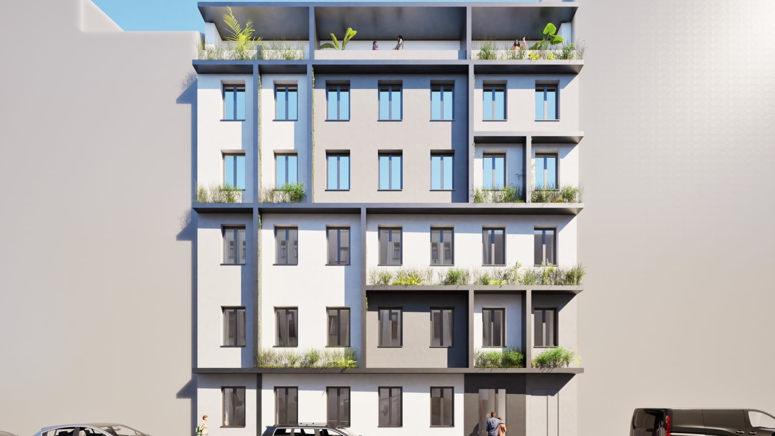 Hier sieht man ein mehrstöckiges Haus mit heller Fassade und hellgrauen Fensterrahmen.