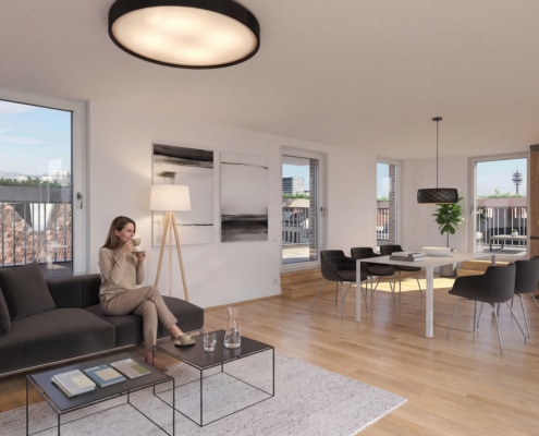 Ein lichtdurchfluteter und möblierter Ess- und Wohnraum mit hellem Parkettboden und Aussicht auf die Terrasse.